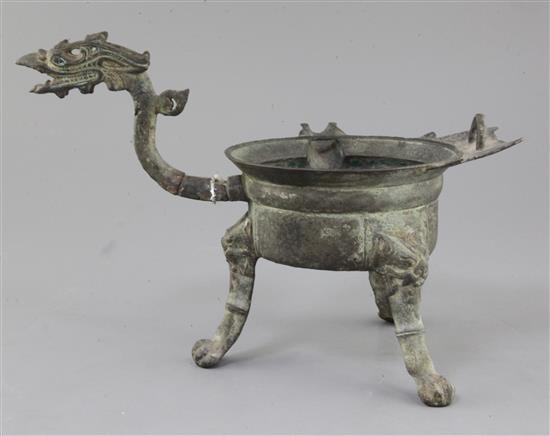 A Chinese archaic bronze tripod ritual wine-warming vessel, Jiao Dou, Southern & Northern dynasties, 6th century A.D., 31cm long, 22cm